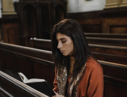 A woman reading the Holy Bible
