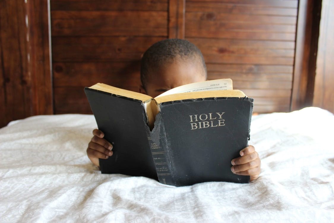 A child reading the Bible 