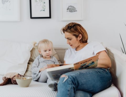 Women reading Bible to a child